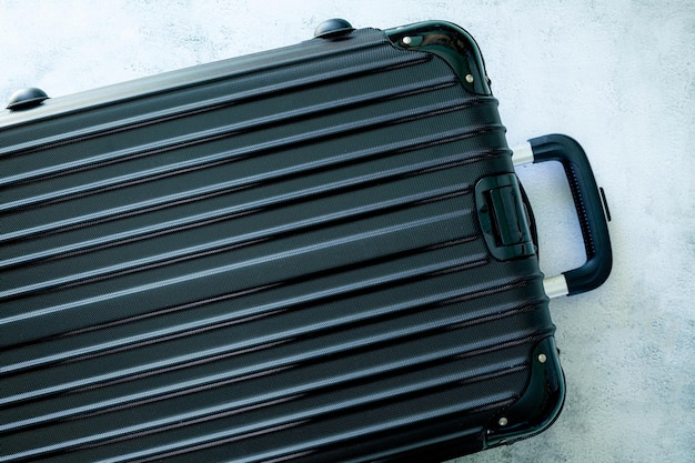 Black travel bag,black luggage set on dark background, top view\
image, flat lay composition. travel