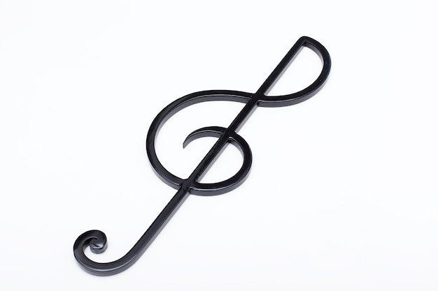 Photo black treble clef on a white background music symbol