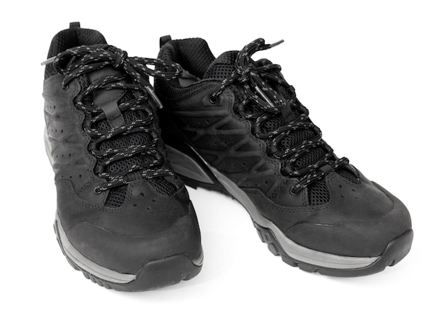 Black trekking boots isolated on white background