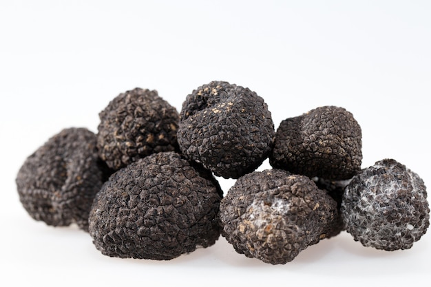 Black truffles isolated on a white background.