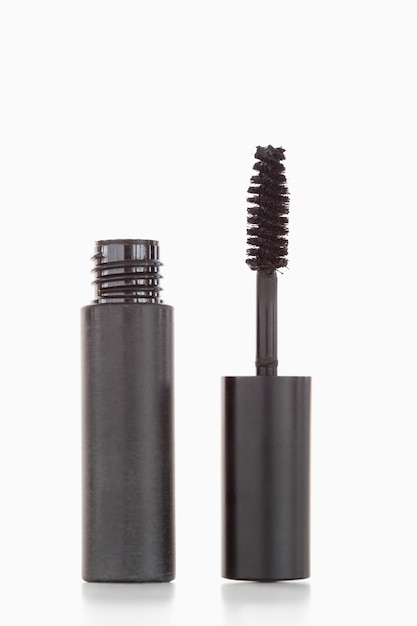 A black tube and brush of mascara 