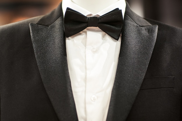 Black tuxedo suit with bow tie on mannequin