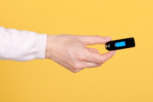 Black usb flash drive in a man's hand