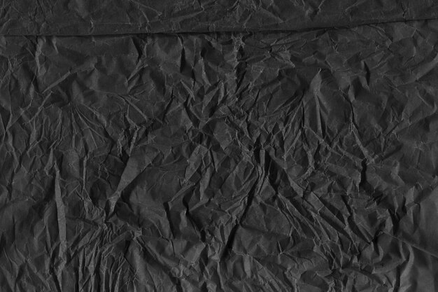 Black vintage and old looking crumpled paper background