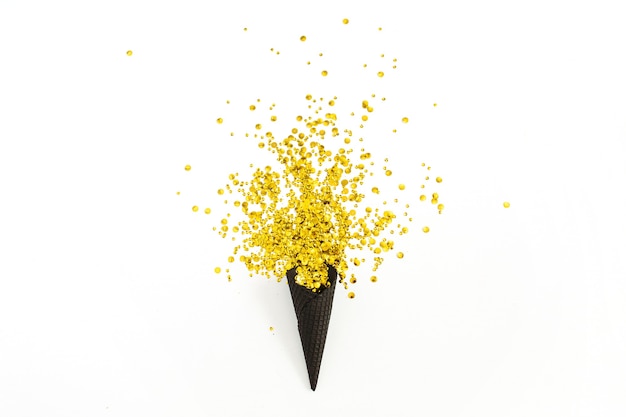 Black waffle cone with golden confetti