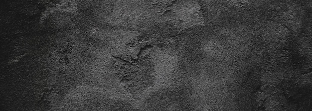 Black wall scary or dark gray rough grainy stone texture background Black concrete for background