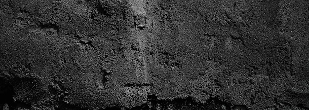 Black wall scary or dark gray rough grainy stone texture background Black concrete for background