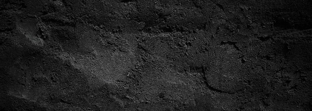 Black wall scary or dark gray rough grainy stone texture background Black concrete for background