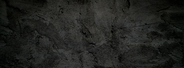 黒い壁怖いまたは濃い灰色の粗い粒子の粗い石のテクスチャ背景背景用の黒いコンクリート