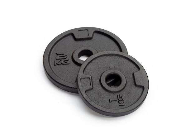 Black weight plates on white background Gym equipment