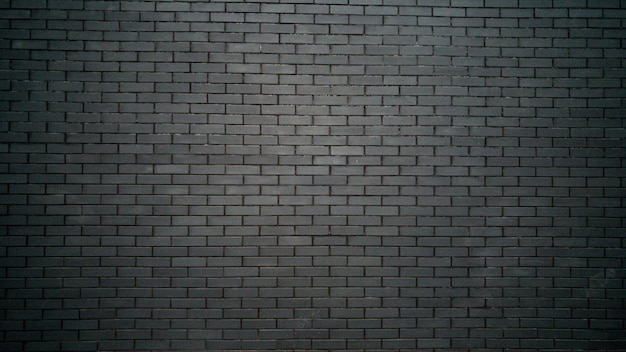 검은 벽돌 벽과 흑백 배경