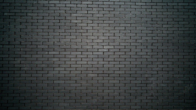 black and white background with black brick wall