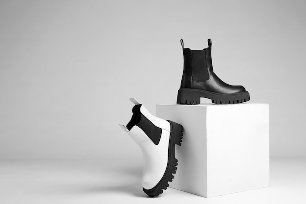 Black and white boots fashion shoes still life