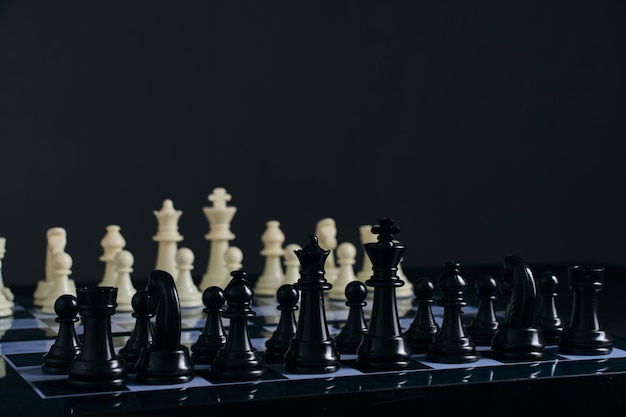 Black and white chess pieces on chessboard