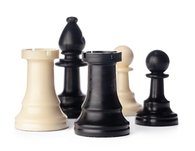 Black and white chess pieces on white background