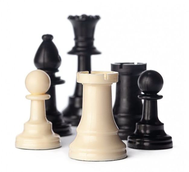 Black and white chess pieces on white 