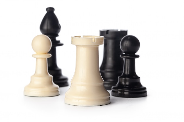 Black and white chess pieces on white 