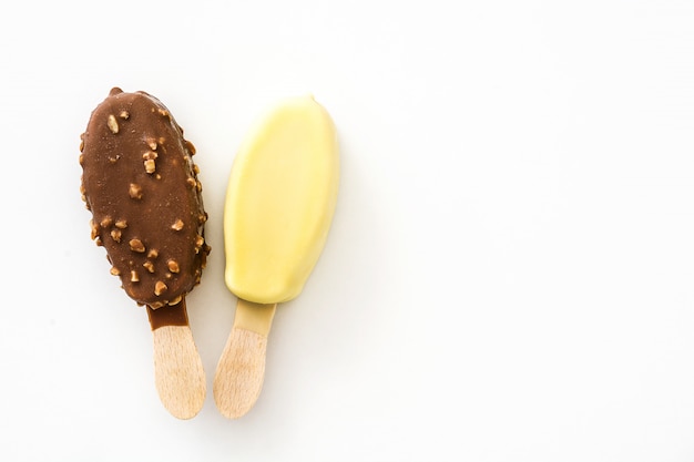 Black and white chocolate ice cream popsicles isolated on white