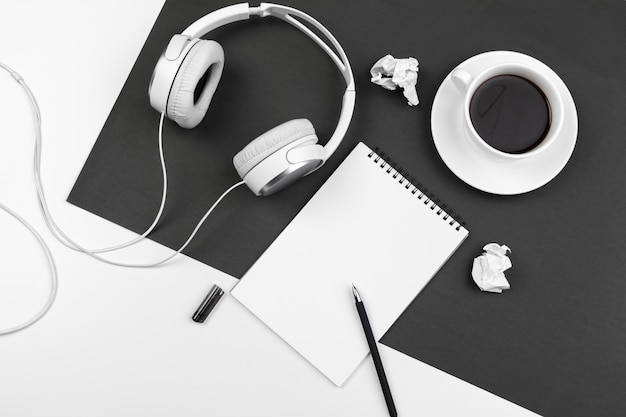 Photo black and white composition with stylish headphones, flat lay