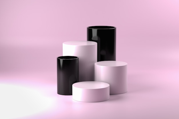 Black and white cylinder pedestals on pink surface