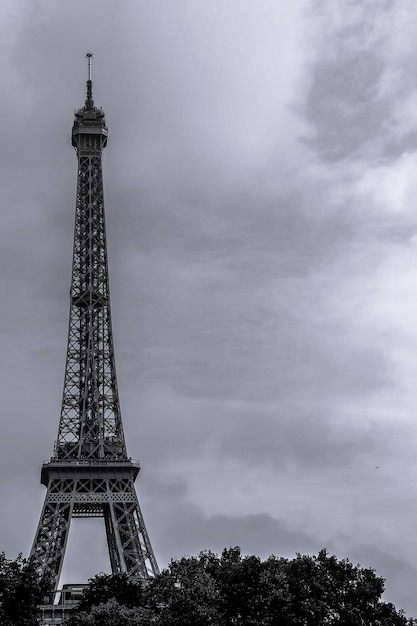 Black and white Eiffel tower nears Seine river