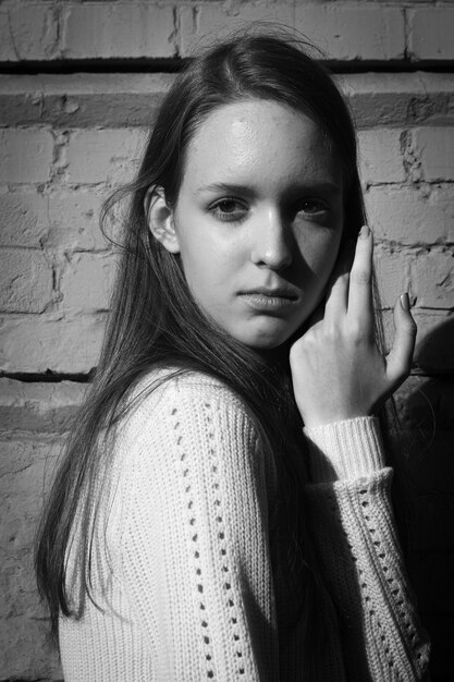 Black and white fashion portrait of a young girl.