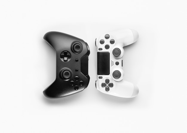 Black and white game controllers on white space