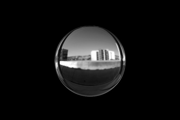 Black and white image of a lensball isolated on black background