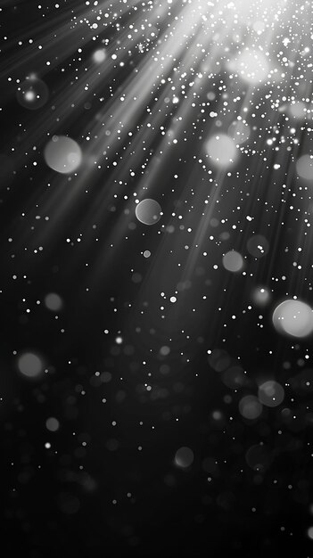 a black and white image of snowflakes falling from the sky