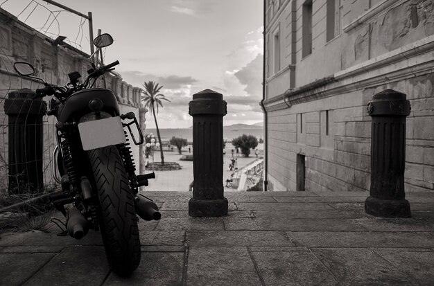 Black and white image of an urban panorama of cagliari which is the background

