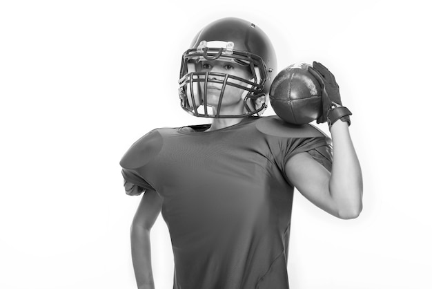 Black and white images of a sports girl in the uniform of an American football team player. Sports concept. White background. Mixed media