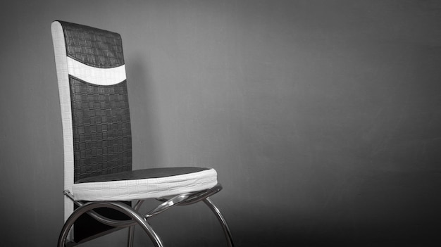 Black And White Leather Office Chair In Grey Background