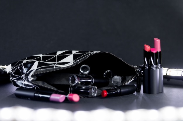 Black and white make up bag with set of lipsticks