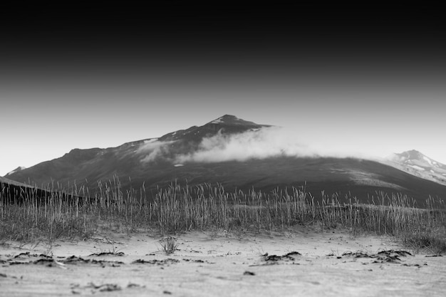 Black and white Norway mountain peak in clouds background hd