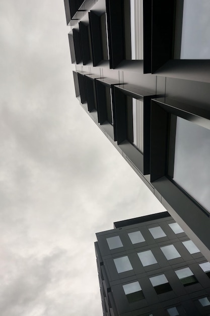 Black and white photo Beautiful modern architecture against the sky