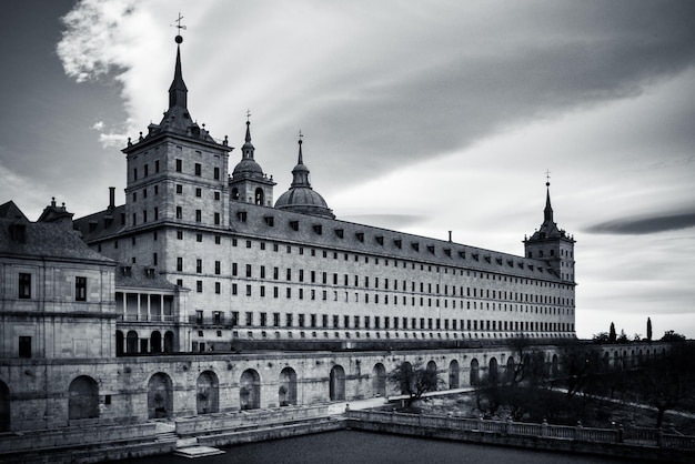 Black and white photo of the Escorial Monastery in San Lorenzo del Escorial in Madrid (Spain).