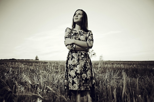 black and white photo of the girl in a field freedom