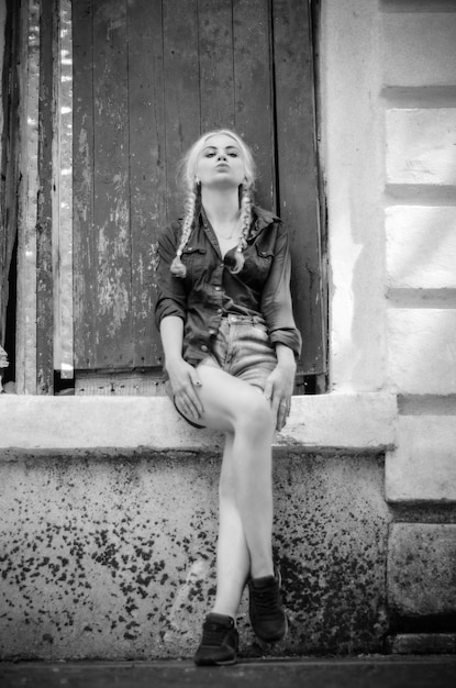 Black and white photo of a girl with braids