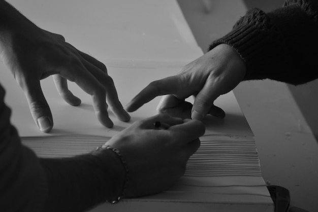 Black and white photo of hands Architecture students