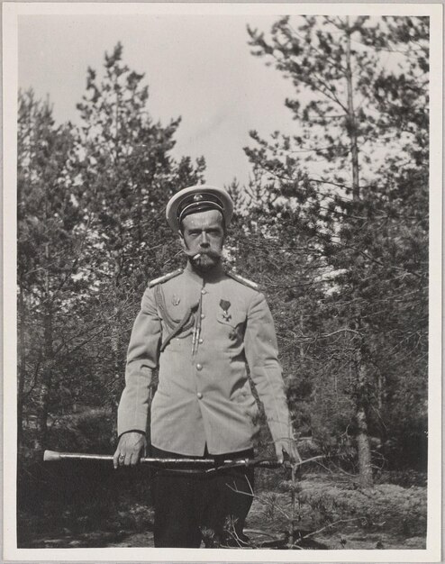 a black and white photo of a man in a uniform with the words  captain  on the front