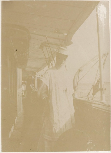 a black and white photo of a man in a white dress and a woman in a white dress