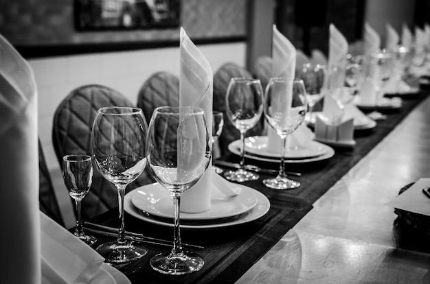 Black and white photography. Empty glasses in restaurant