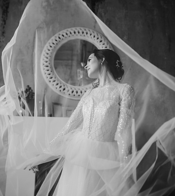 Black and white portrait of an elegant bride in a wedding dress