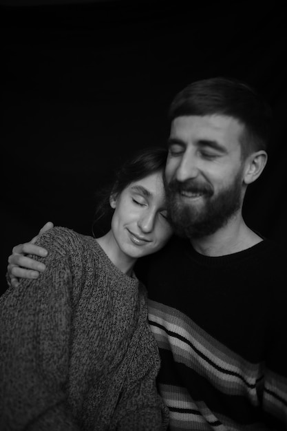 black and white portrait of a loving couple closeup on a black background Couple in love