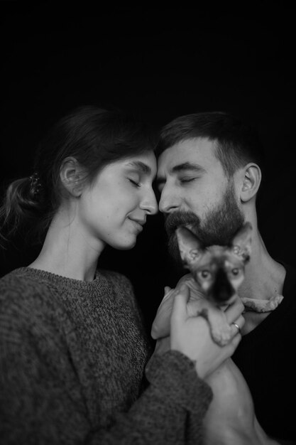 black and white portrait of a loving couple closeup on a black background Couple in love