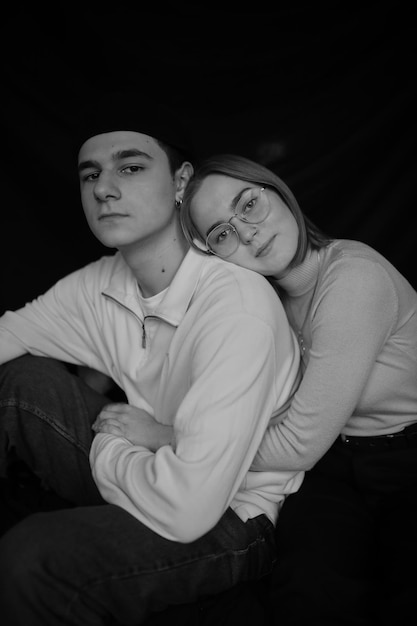 black and white portrait of a loving couple closeup on a black background Couple in love