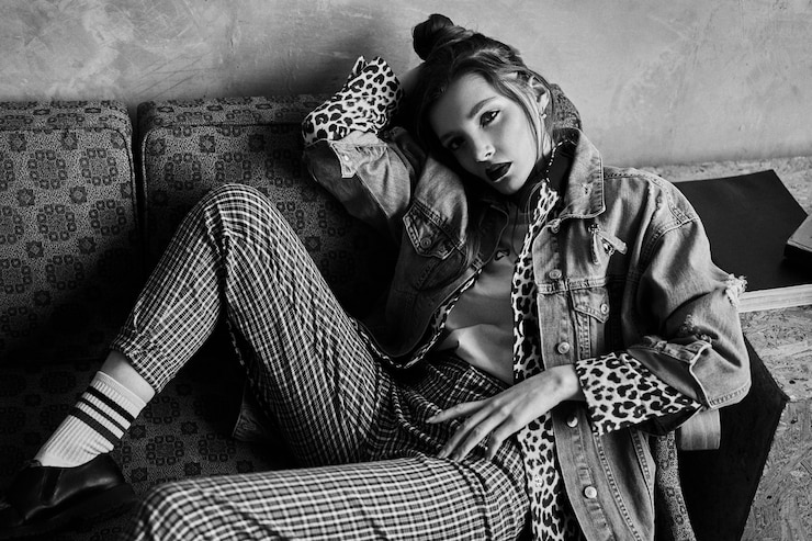 Black-white portrait of a sexy girl in grunge style. Dramatic black and white photo of a beautiful woman on a dark