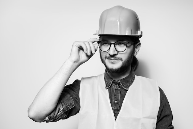 Black and white portrait of young confident construction worker