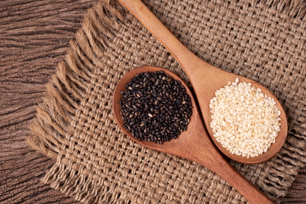 black and white sesame on wood table.