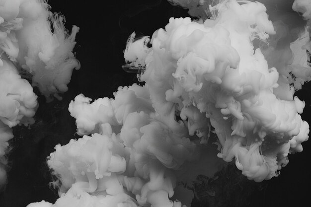 Black and white smoke explosion on a black background
